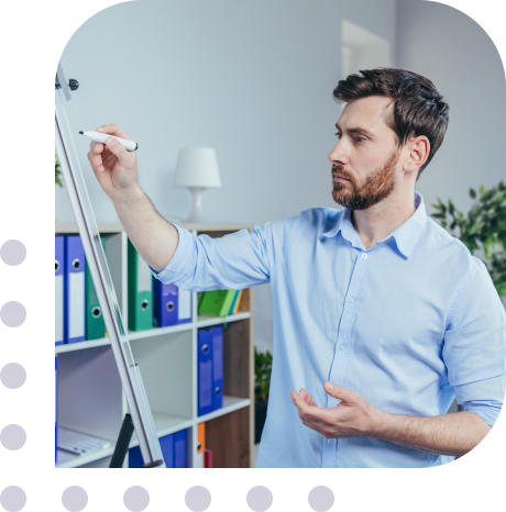 white man writing on whiteboard