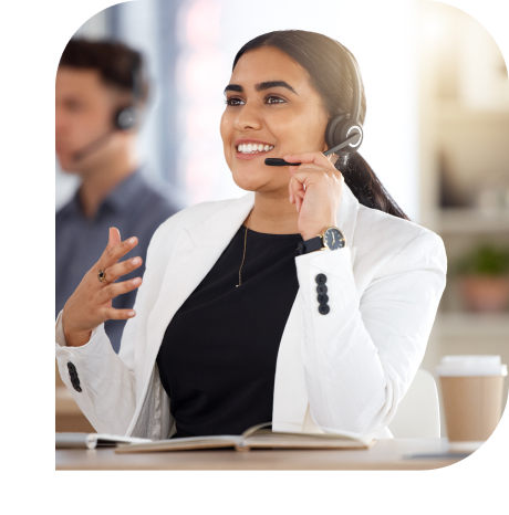 woman in white suit calling with headphones