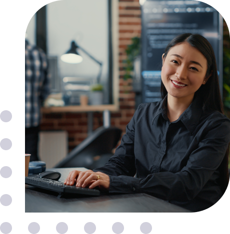 asian woman typing on a keyboard